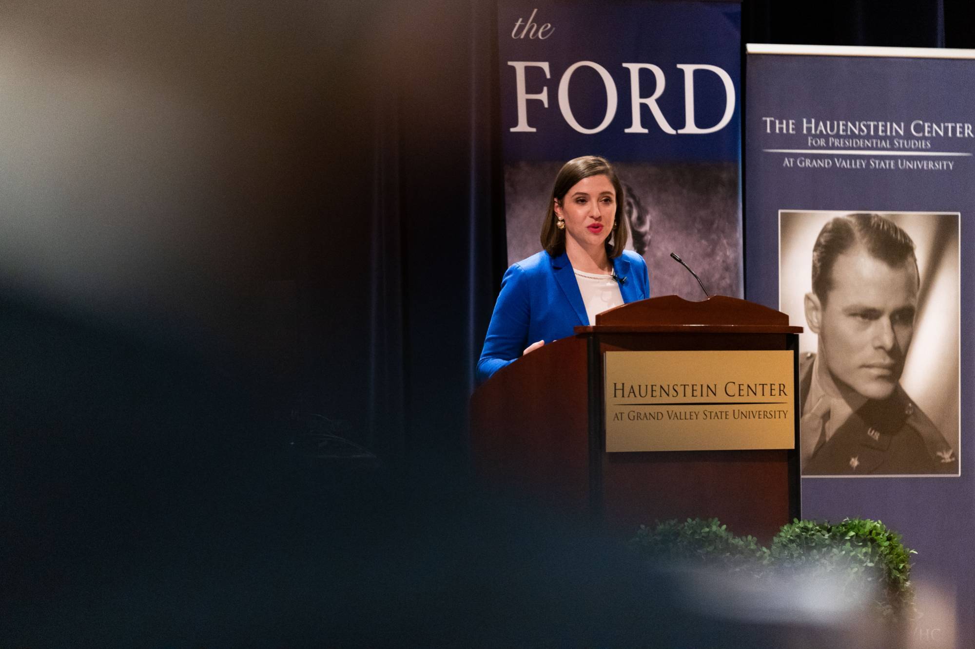 Guest speaker Lindsay Chervinsky speaks from the stage.